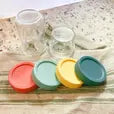 the rust, teal, yellow, and green storage lids from Mason Bottle