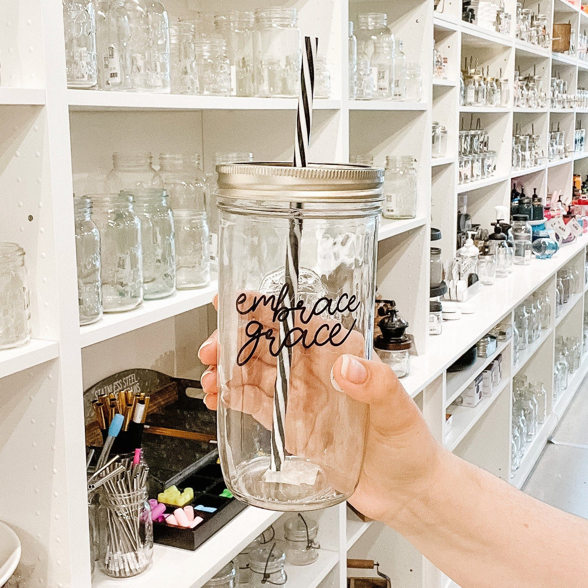 Photo of mason jar tumbler with a "Embrace grace" text