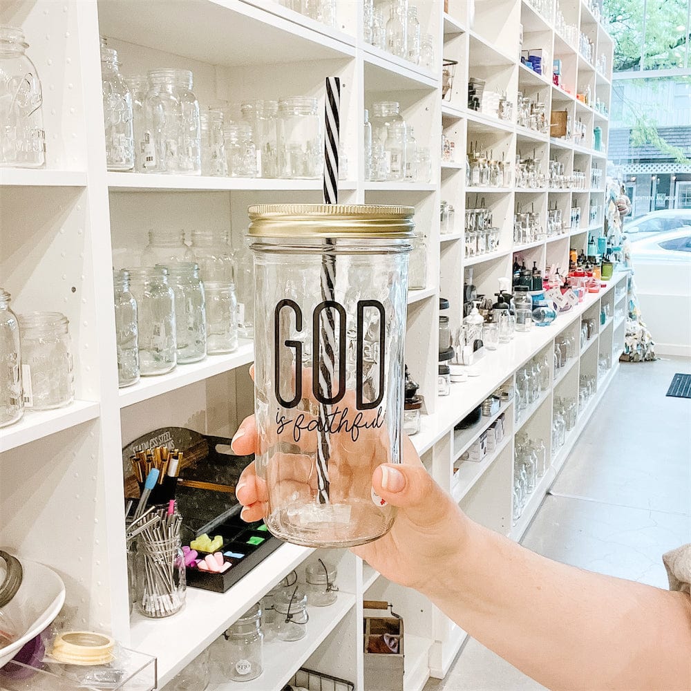 Wide angle of a mason jar tumbler that says “god is faithful”