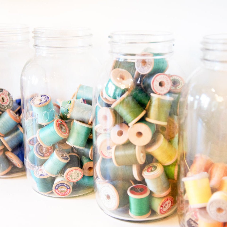 Gem mouth half gallon mason jar against a white background