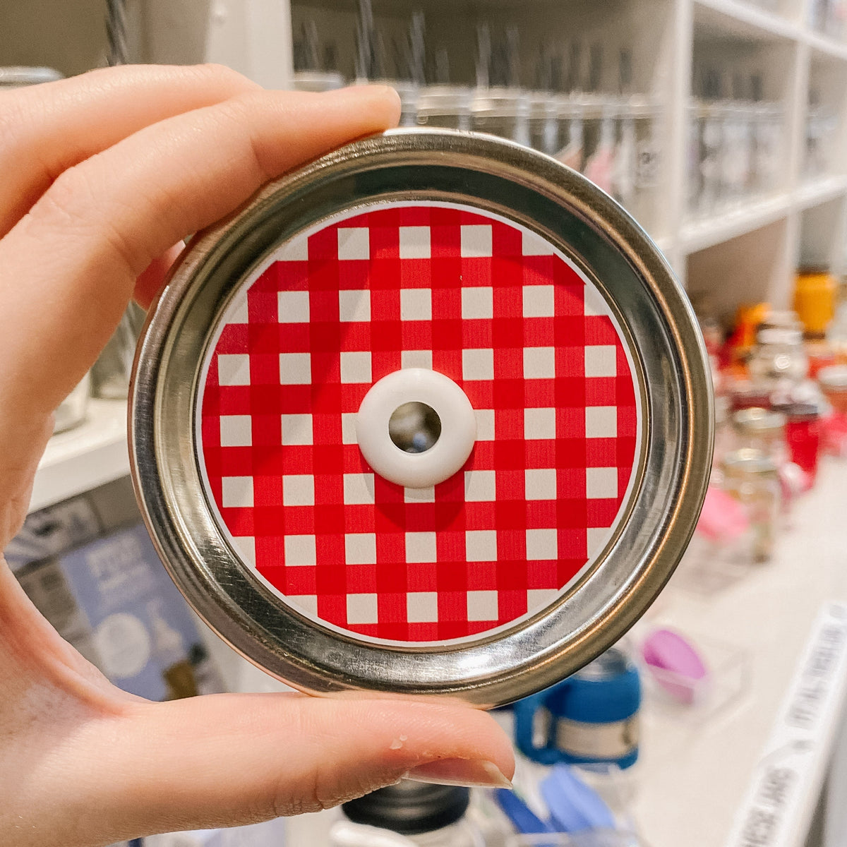 straw lid with a red and white gingham pattern