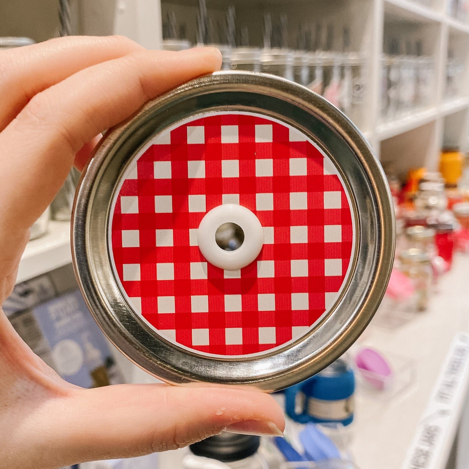 straw lid with a red and white gingham pattern
