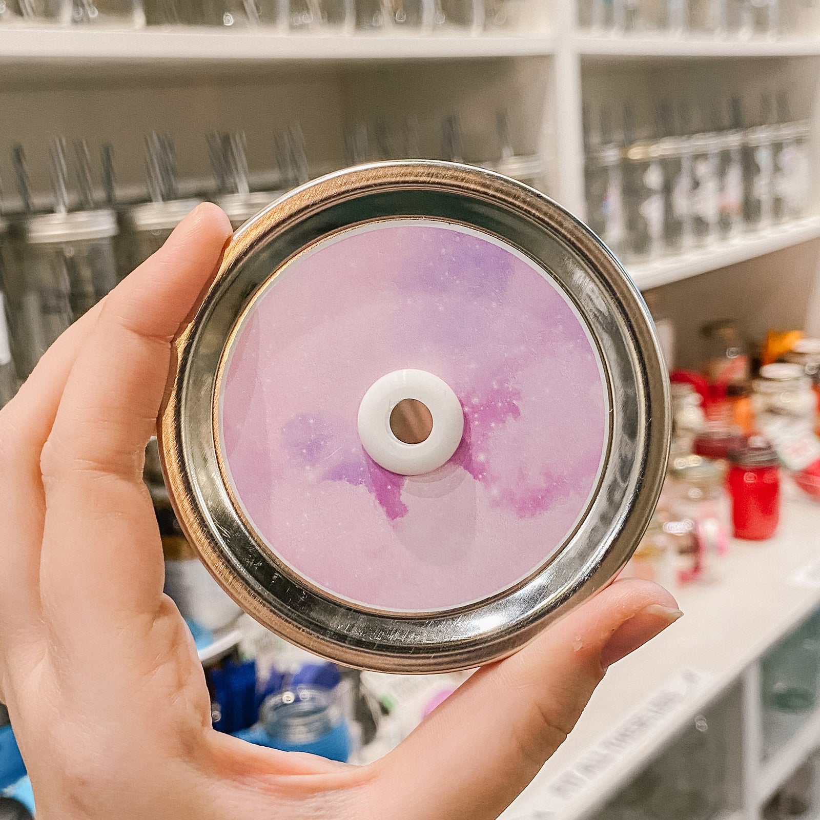 straw lid with a galaxy print in different shades of purple