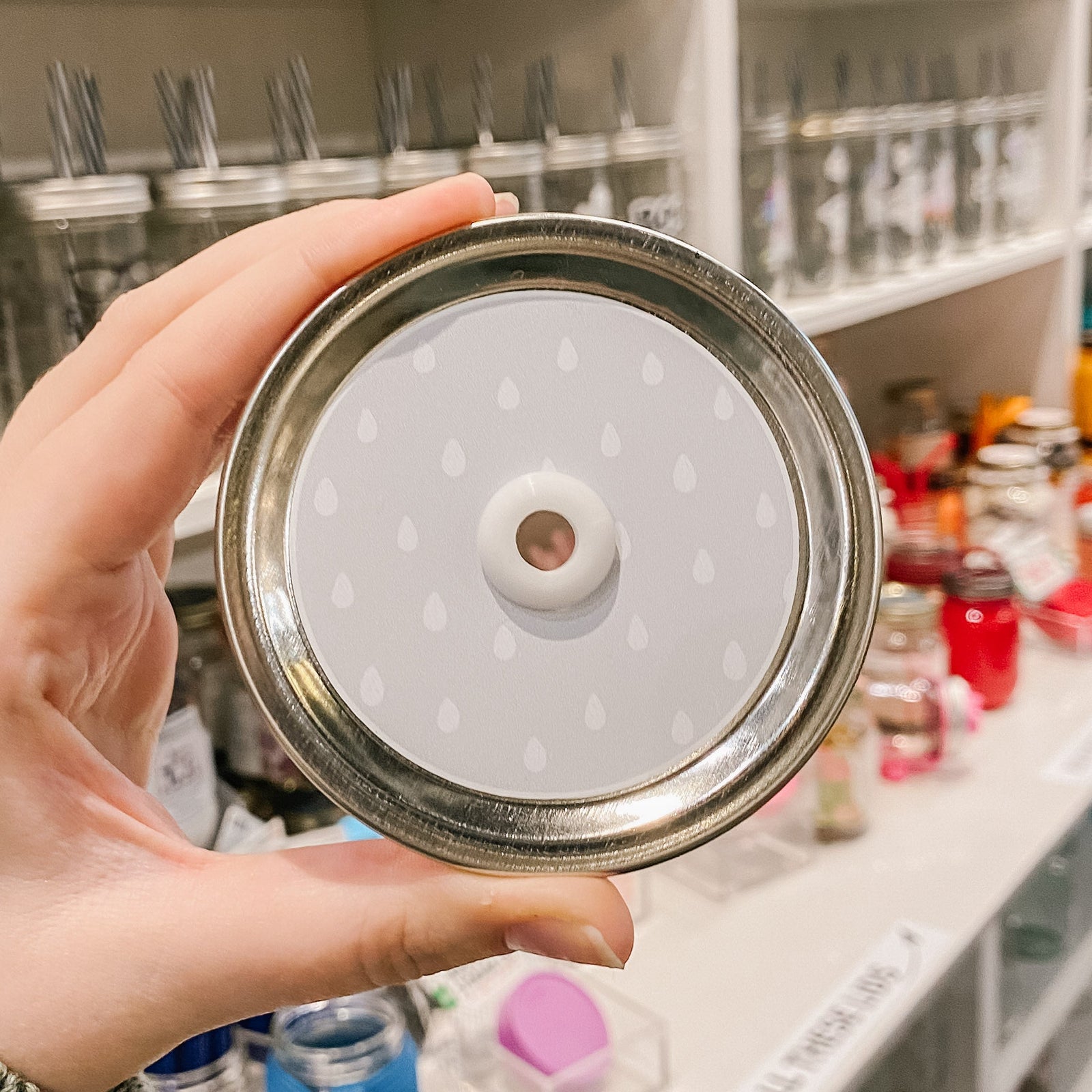 straw lid with white raindrops on a grey background