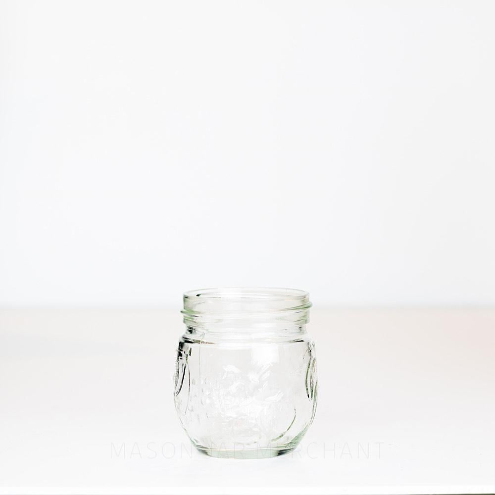 6.5 oz regular mouth mason jar with a unique bulb shape and a fruit pattern on a white background