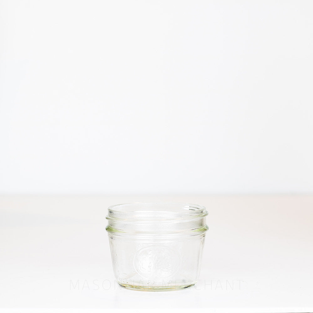 Half-pint wide mouth mason jar against a white background