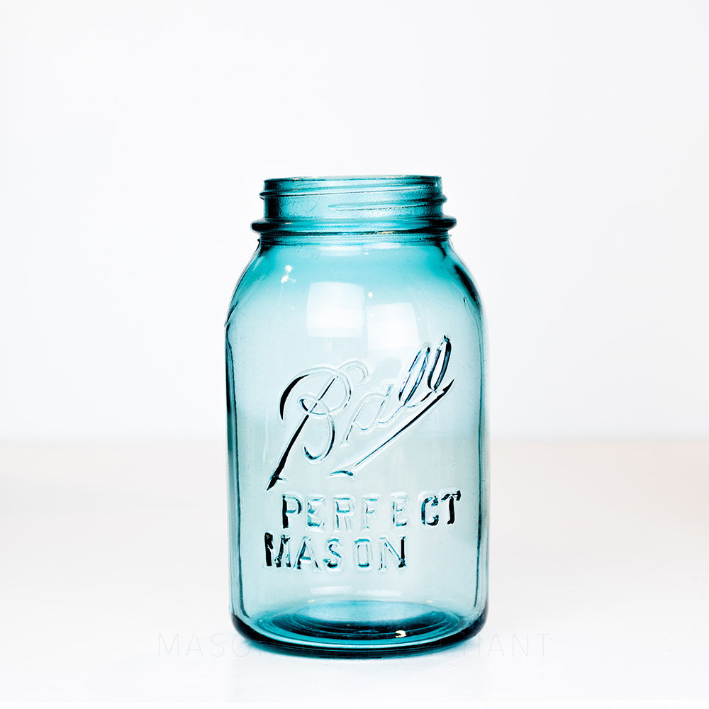 Vintage blue regular mouth quart Ball Perfect Mason jar on a white background