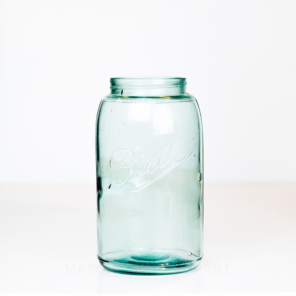 Vintage green-blue Ball regular mouth quart mason jar on a white background