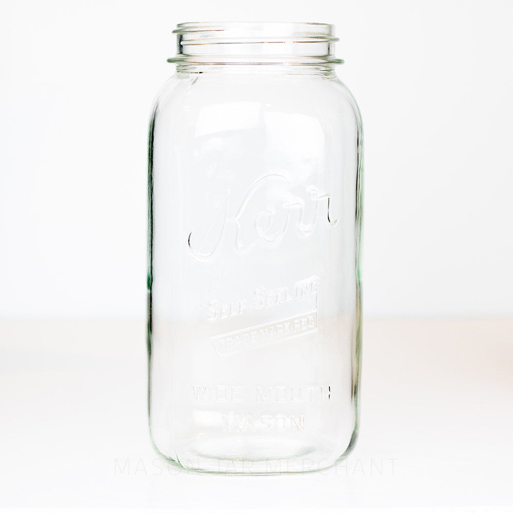Wide mouth half-gallon mason jar with Kerr Self-sealing trade mark logo on a white background