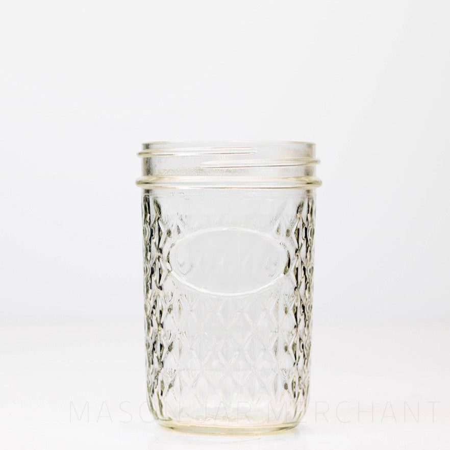 quilted wide mouth glass mason jar on a black and white background