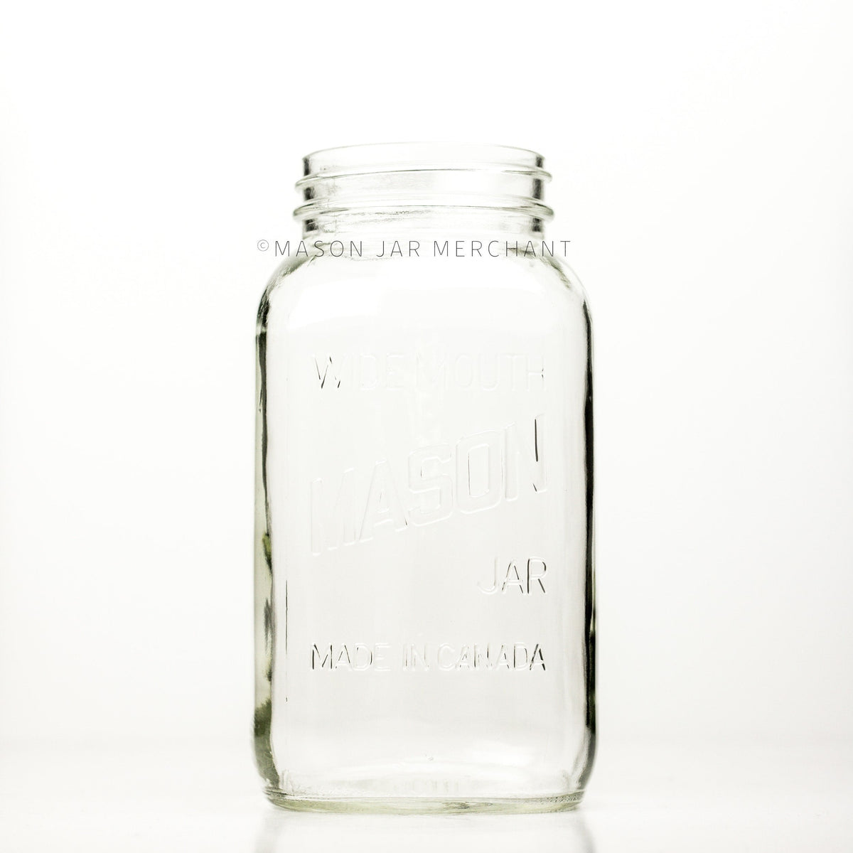 Wide mouth half-gallon mason jar with Mason logo, against a white background