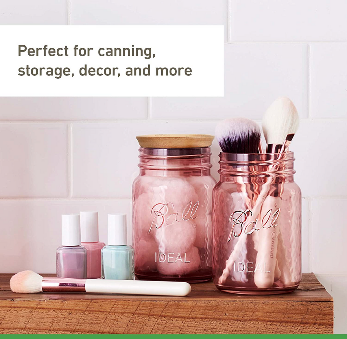 picture of a bathroom shelf with makeup, nail polish, and two mason jars that are a rose pink colour. Each jar has something inside it: cotton balls, and makeup brushes