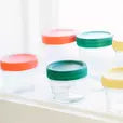 6 mason jars with 2 rust coloured lids, 2 green lids, and 2 yellow lids