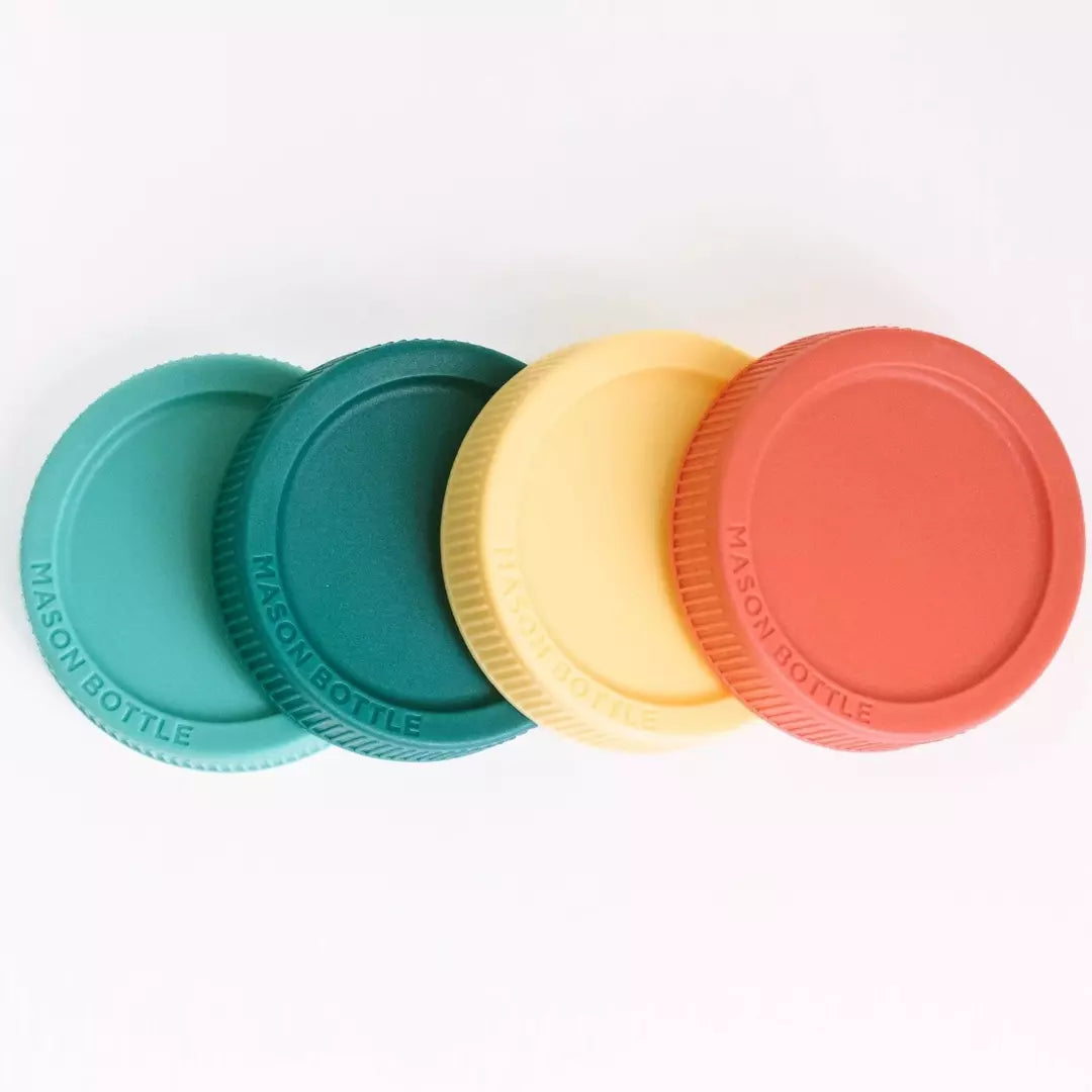 4 plastic storage lids from the brand Mason Bottle, they are green, teal, yellow, and rust