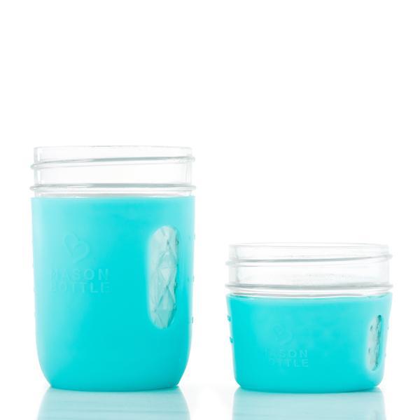 4 oz &amp; 8 oz glass reusable jars sit side by side. Both have an aqua silicon sleeve on them