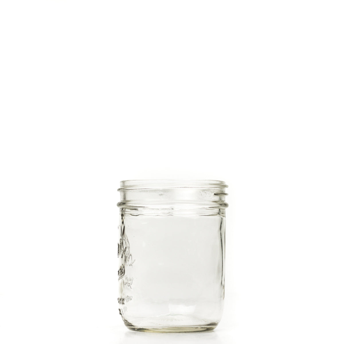 Wide mouth pint mason jar side view against a white background