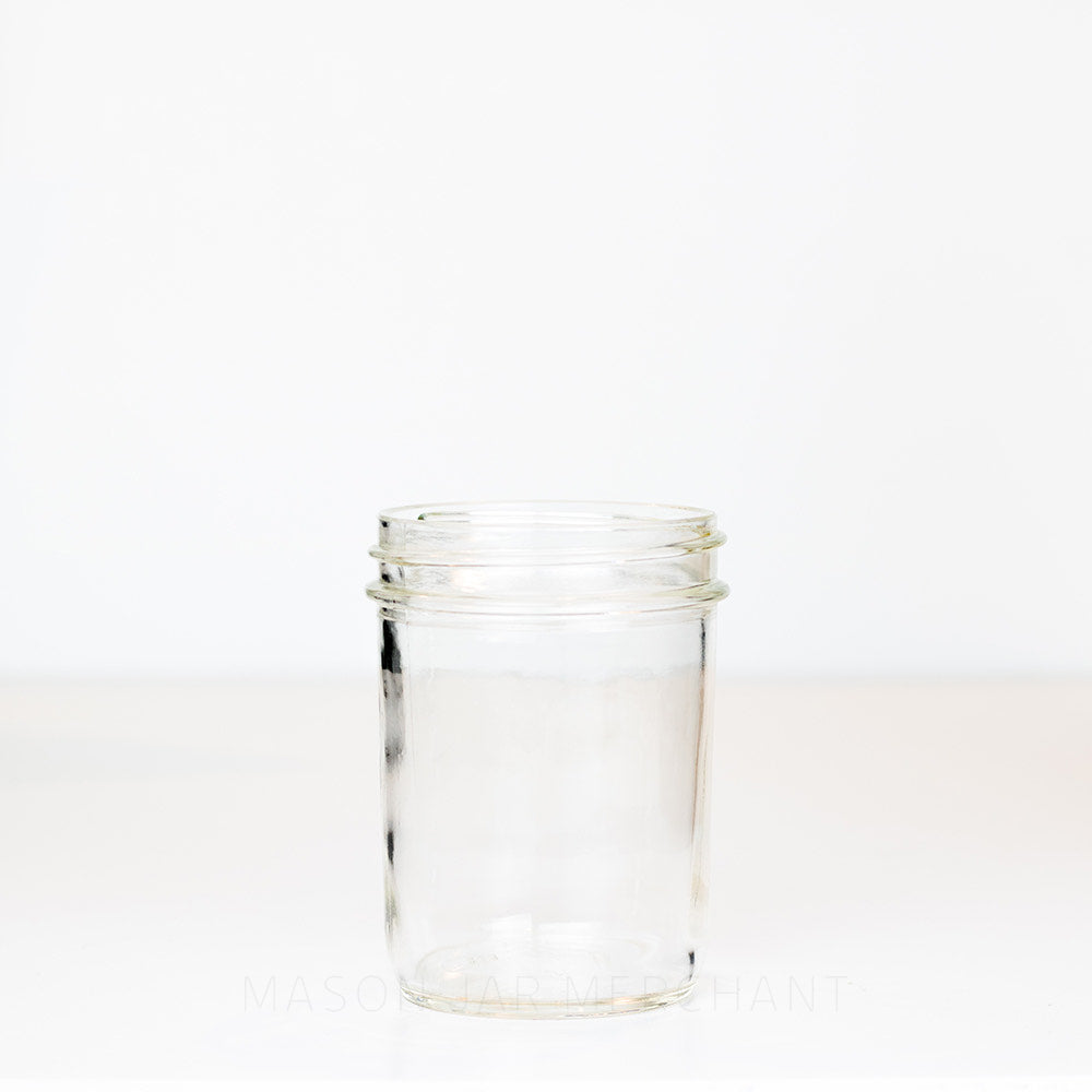 Smooth-sided Dominion wide mouth pint mason jar against a white background