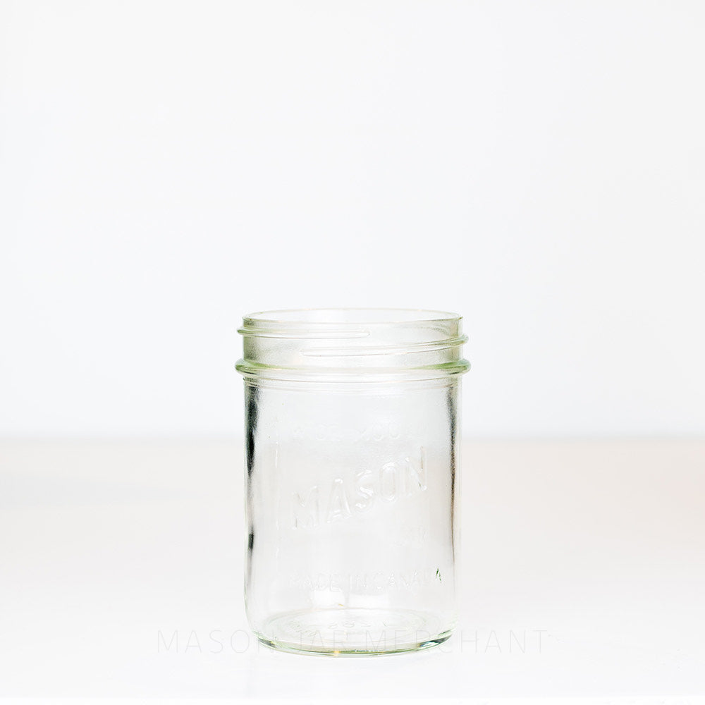 Wide mouth pint mason jar with Canadian Mason logo against a white background