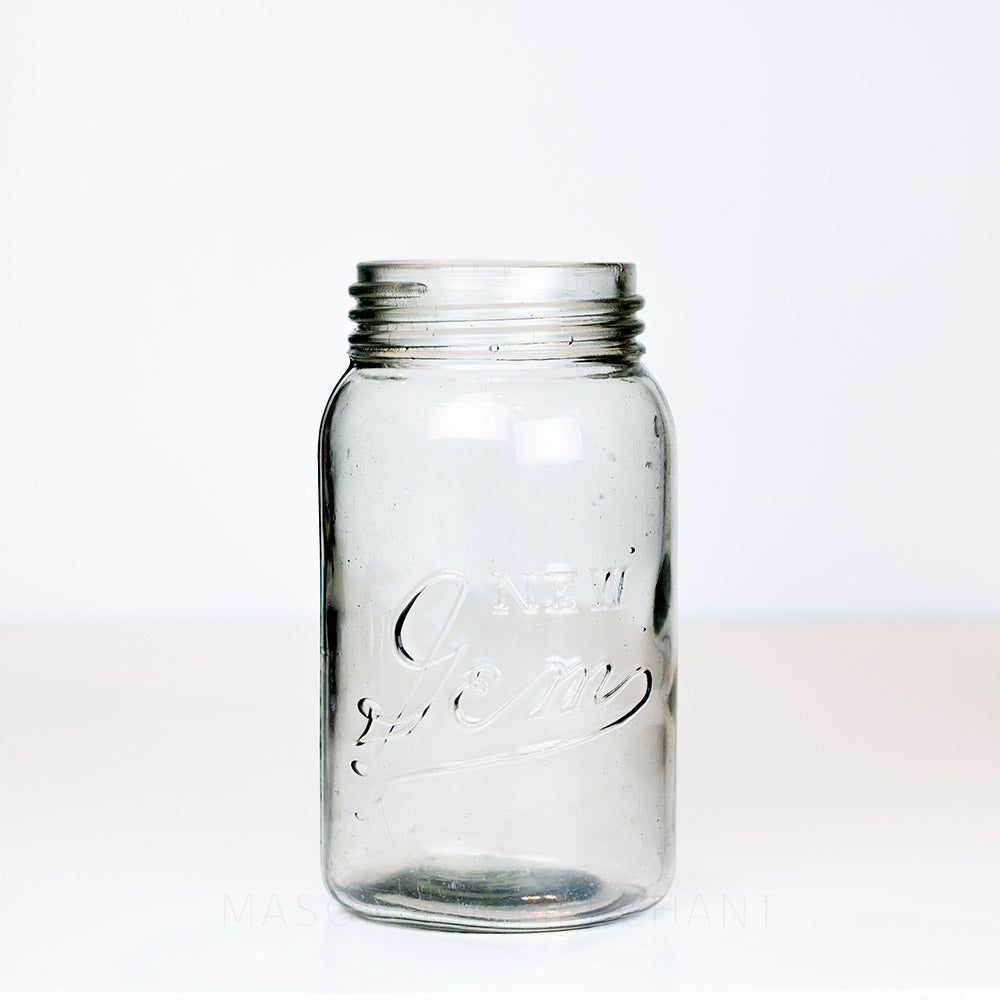 Grey-toned vintage gem mouth 28 oz mason jar with New Gem logo. On a white background