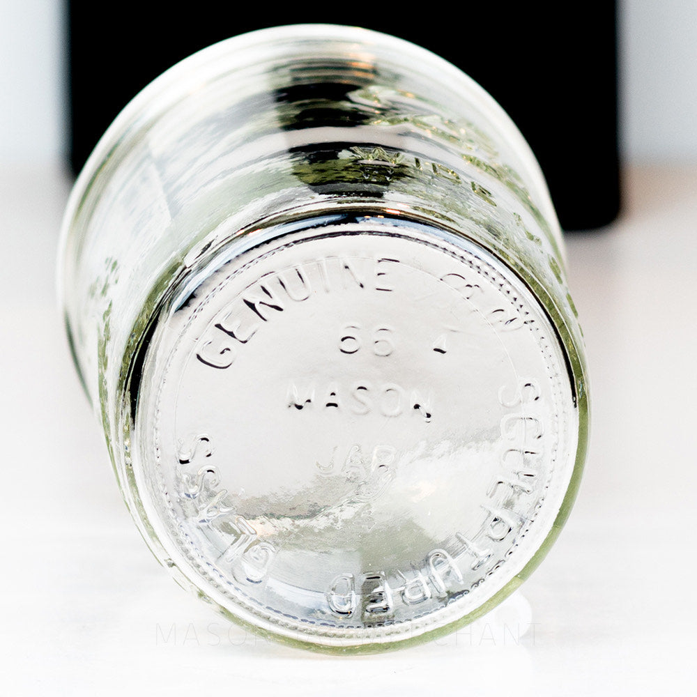 Bottom of a Wide mouth pint Ball mason jar against a white background
