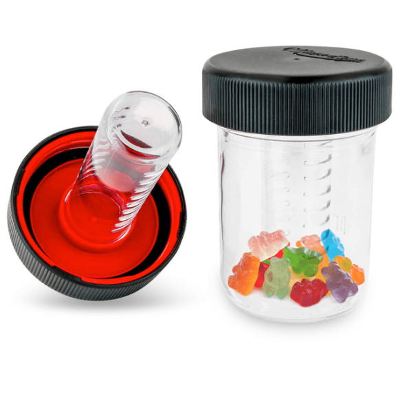 Child resistant stash lid and bottle filled with colourful gummy bears. another lid sits off to the side