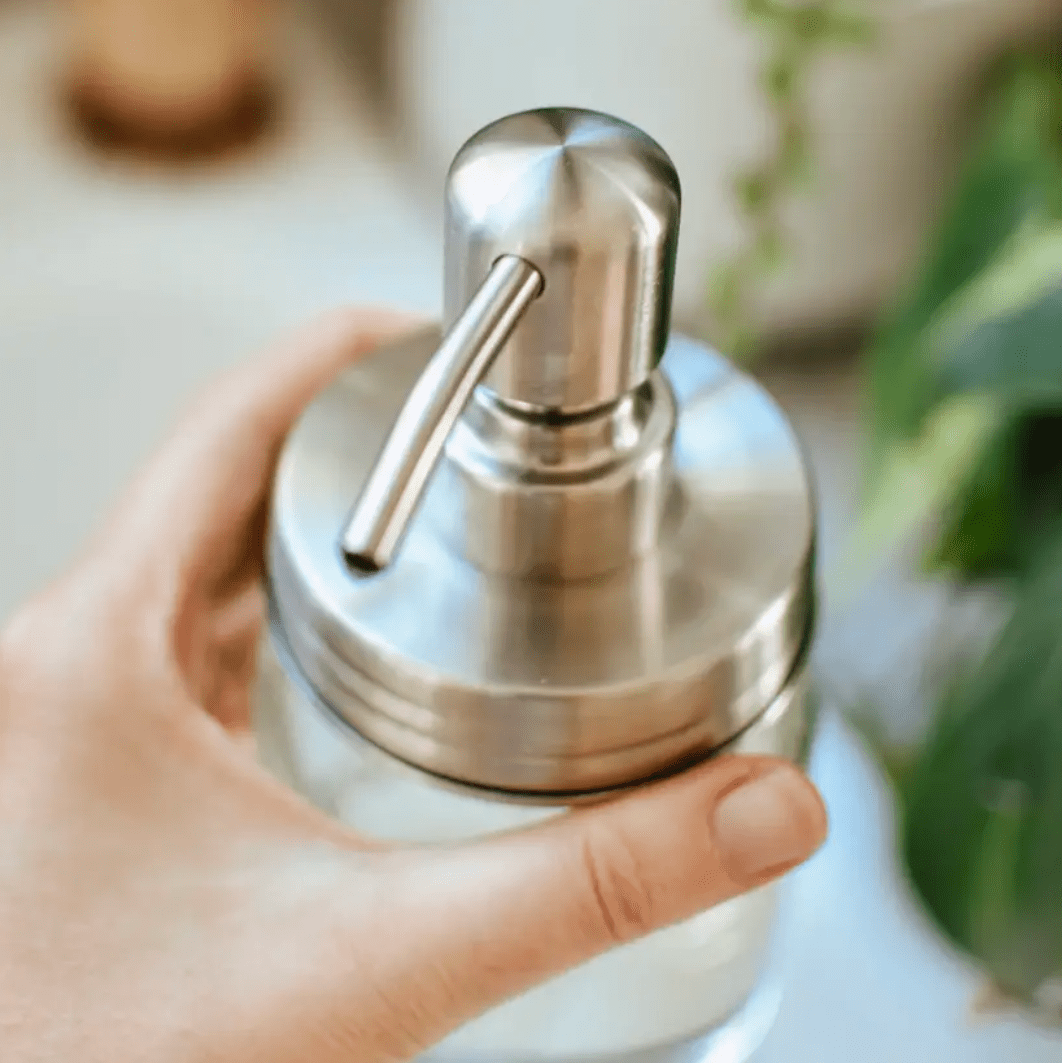 Photo of a stainless steel foaming soap pump in a regular mouth.