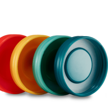 Photo of plastic lids showing its interior with silicone lids in Paprika, Mango, Aqua, and Deep Ocean on a white background.
