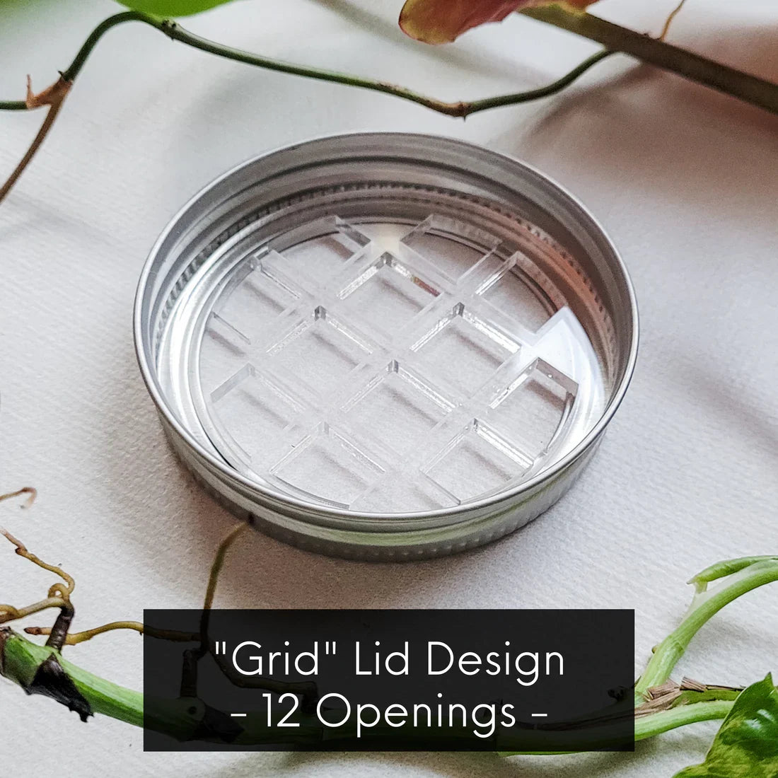 Leaf & Node stainless steel grid design mason jar lid insert with 12 openings for plant propagation, on light fabric