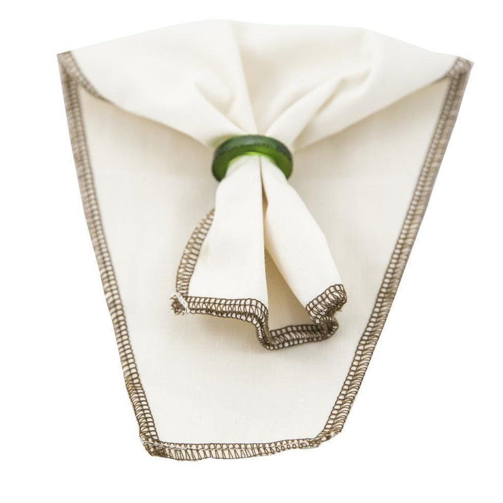 Fabric enclosed with a green glass ring.