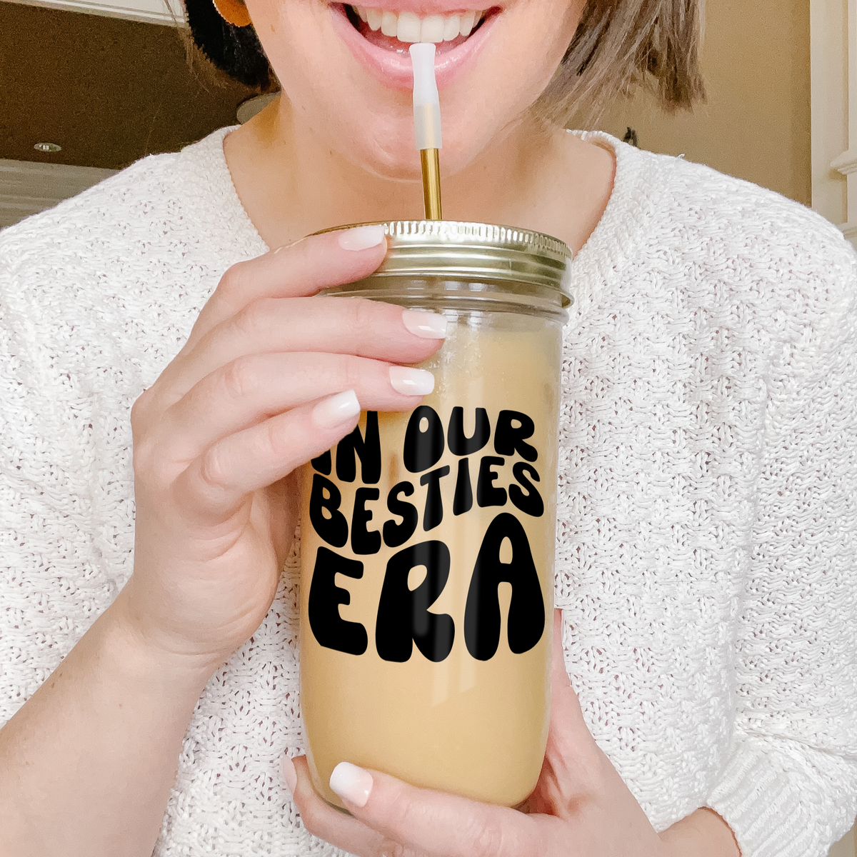 Girl holding a tumbler with an example of our Retro Era Custom tumbler