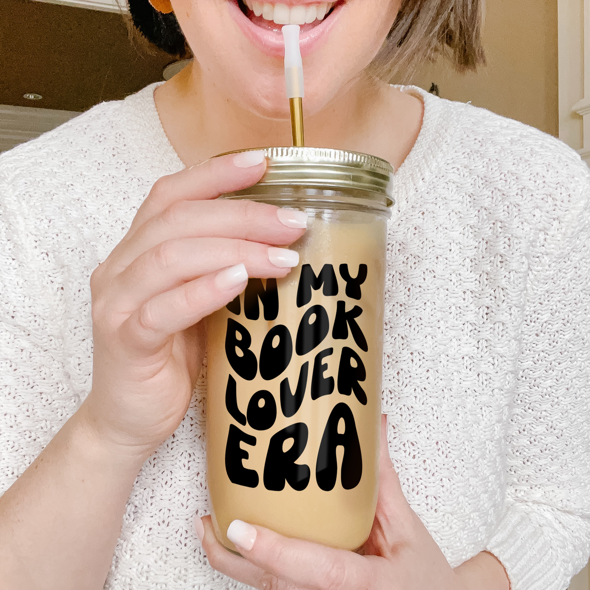 Girl holding a tumbler with an example of our Retro Era Custom tumbler