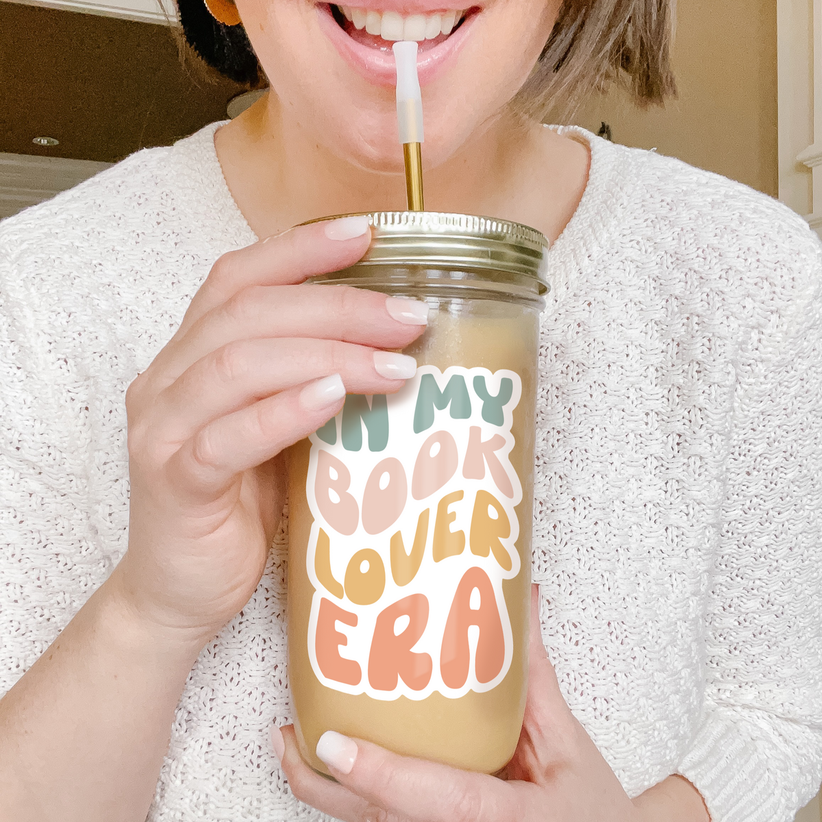 Girl holding a tumbler with an example of our Retro Era Custom tumbler