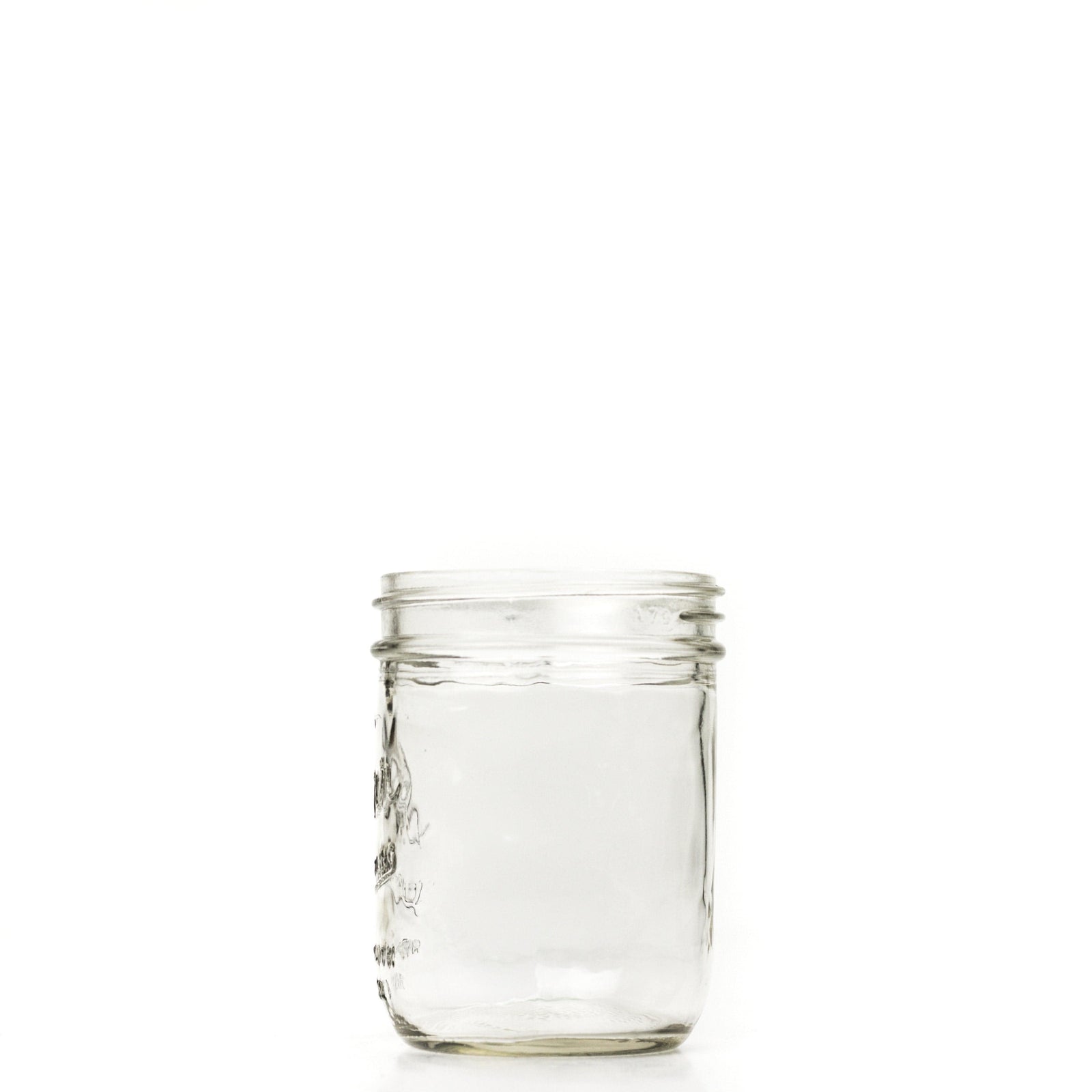 Wide mouth pint mason jar side view with a ruler for height comparison