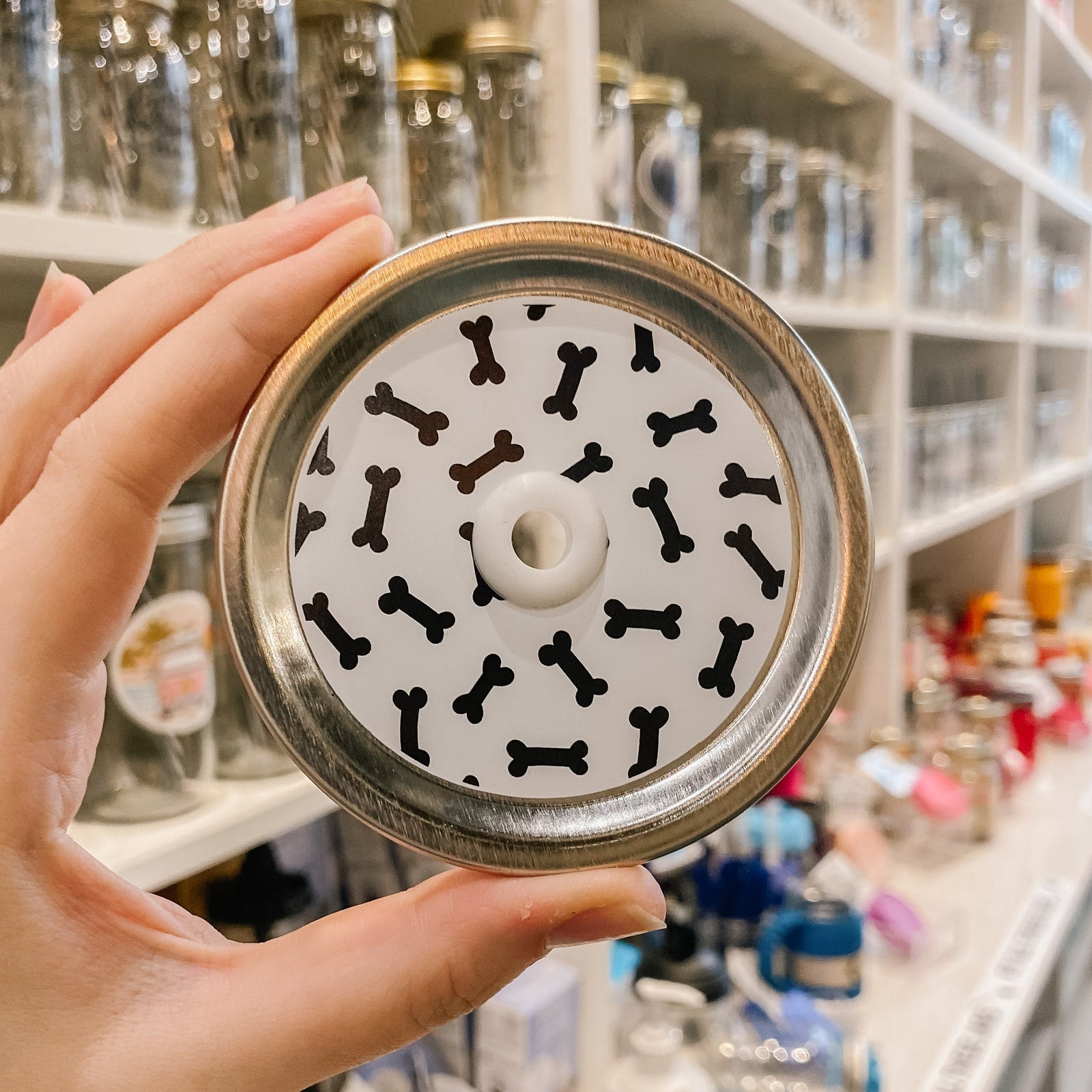straw lid with white background and black dog bones