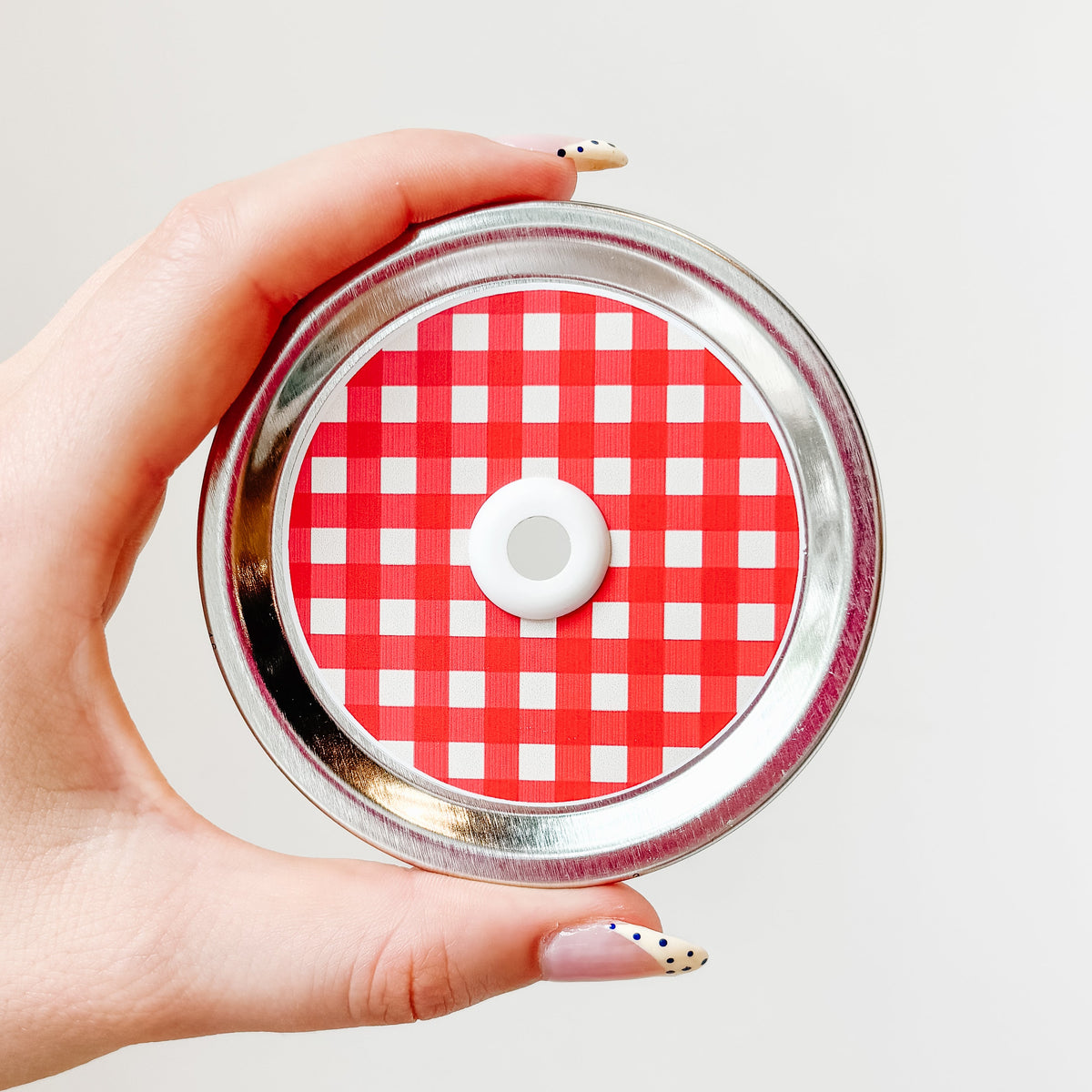 straw lid with a red and white gingham pattern