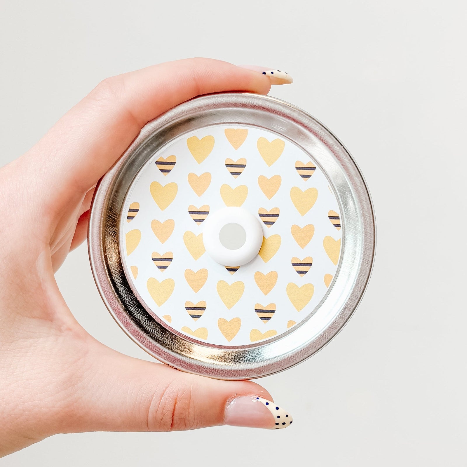 top photo of mason jar lid with a heart colored like a bee And yellow heart