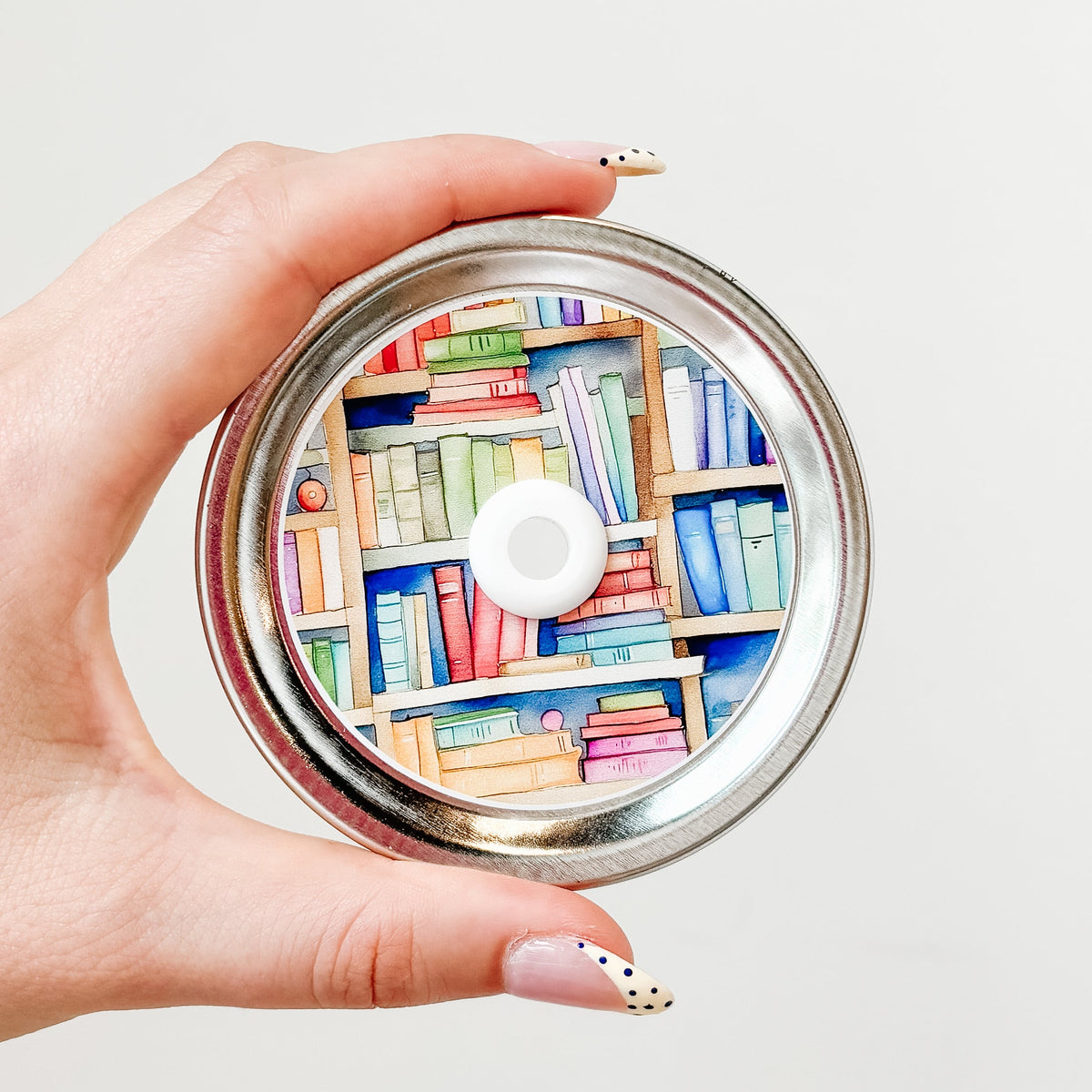 straw lid that is a close up of multicoloured books on a bookshelf