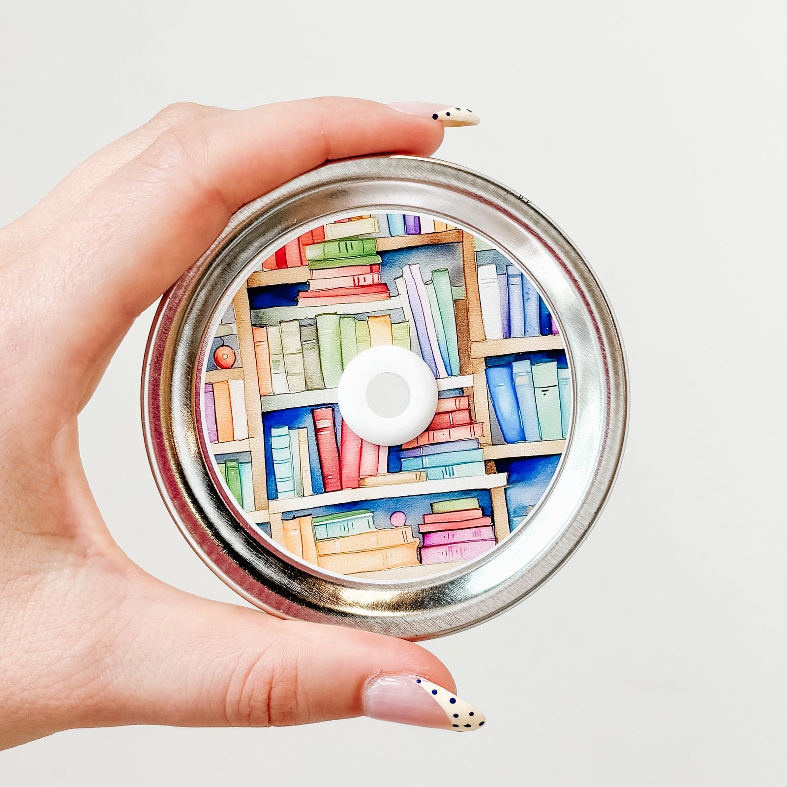 straw lid that is a close up of multicoloured books on a bookshelf