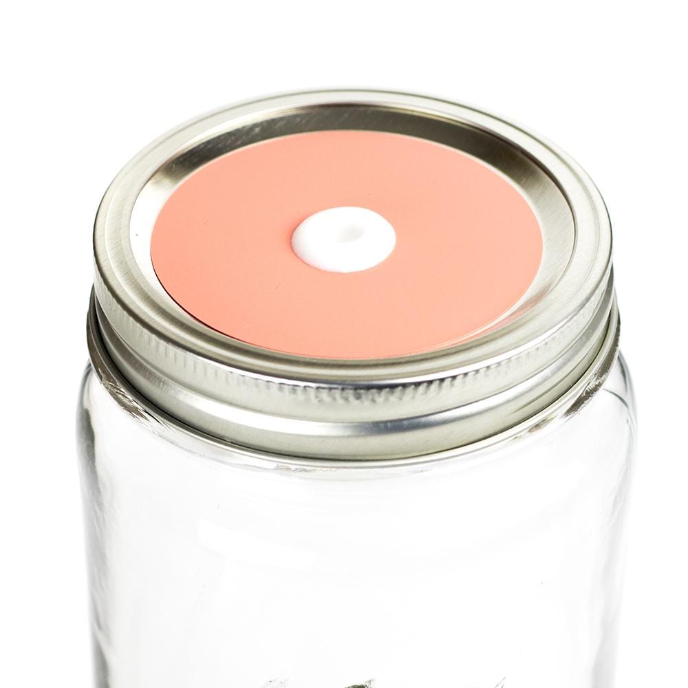 Photo of a mason jar with a straw lid with a colored decal. Photographed against a white background.