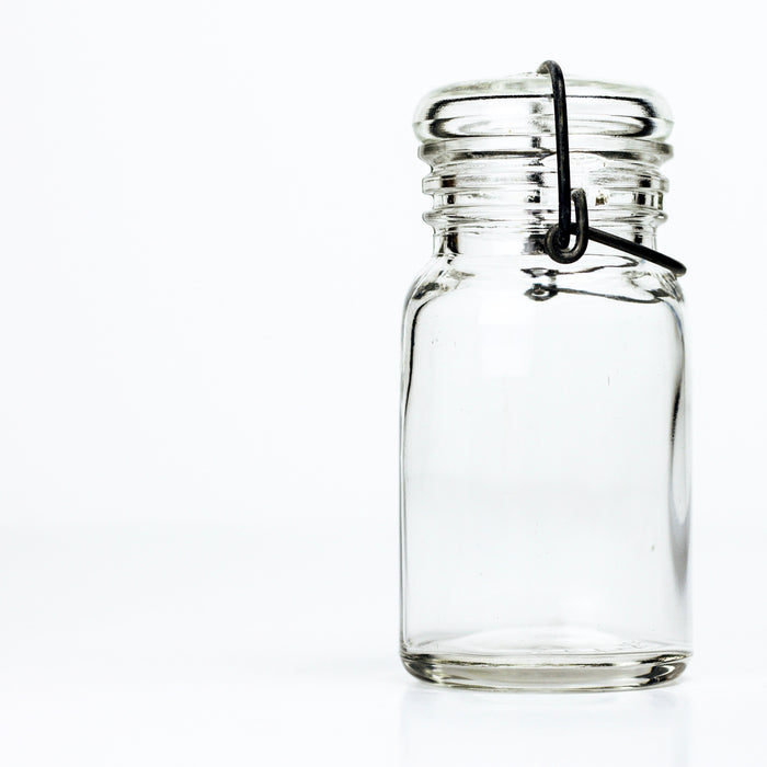 Vintage Wheaton style unmarked 1930s half-pint wire bail mason jar with glass lid, clear product shot on white