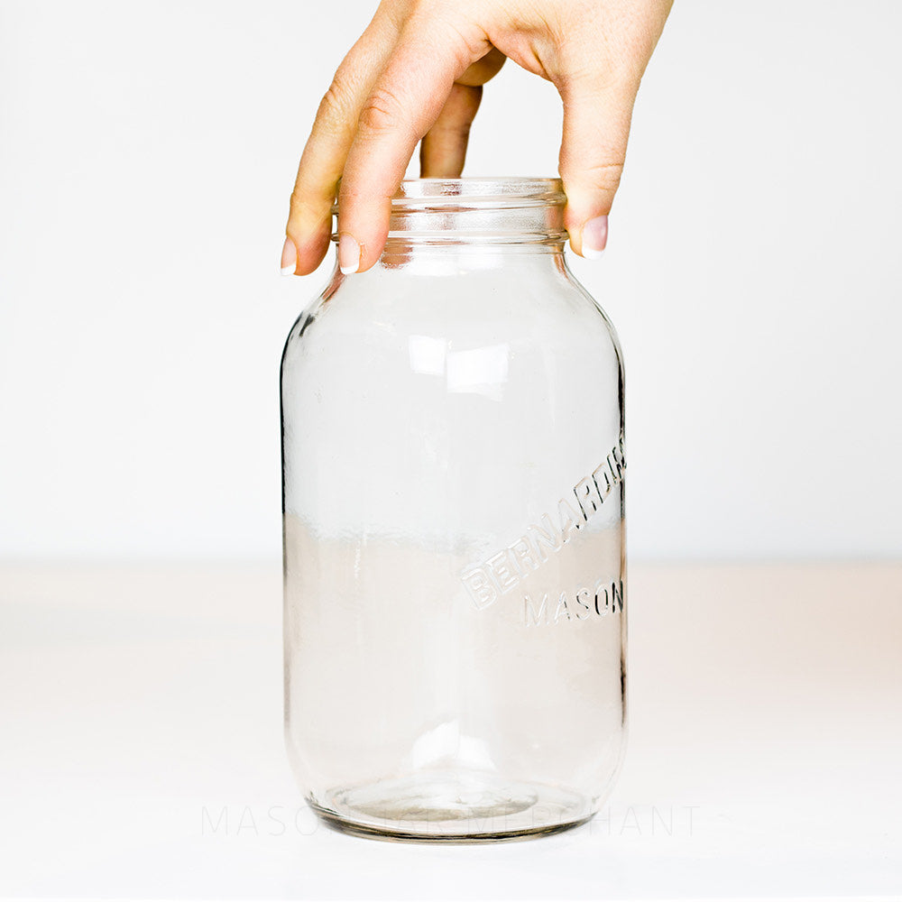 Regular mouth quart mason jar with Bernardin mason logo, on a white background