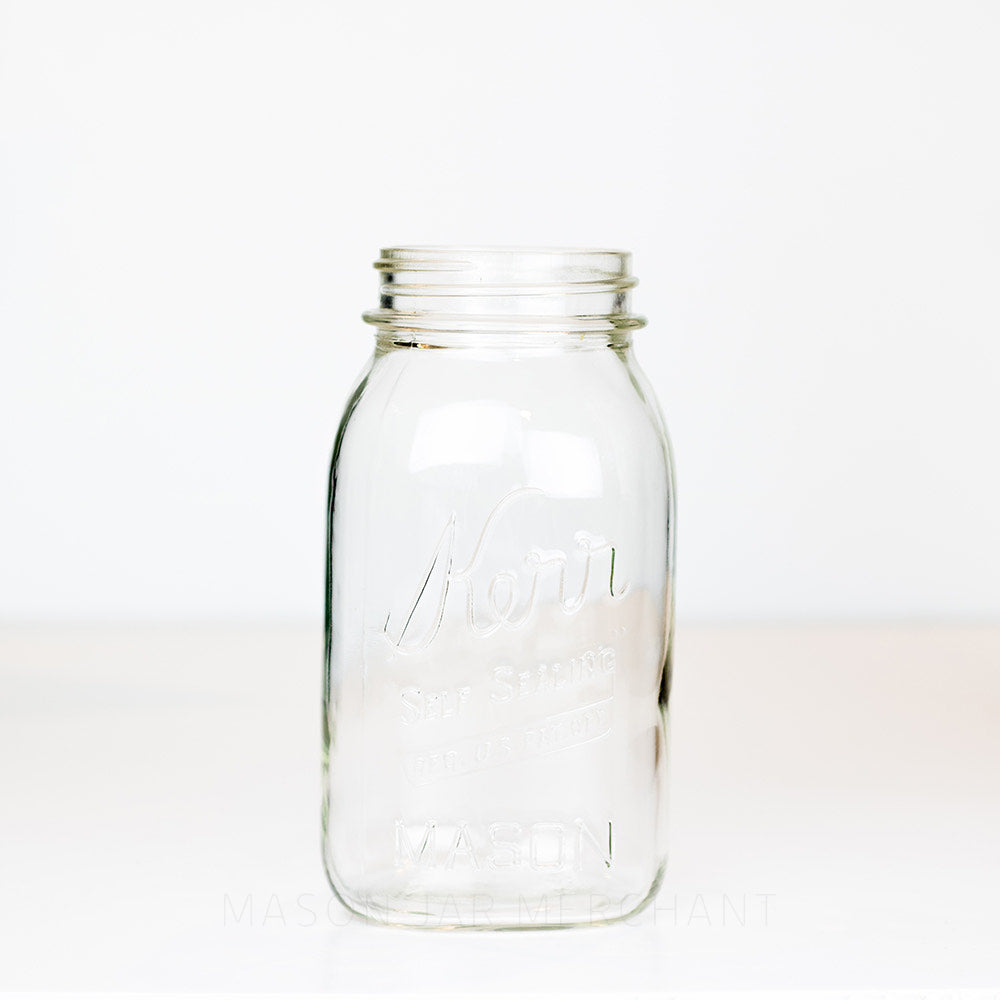 Vintage Kerr Regular Mouth Quart Jar on White Background. Reads Kerr "Self Sealing" [REG. U.S. PAT. OFF.].