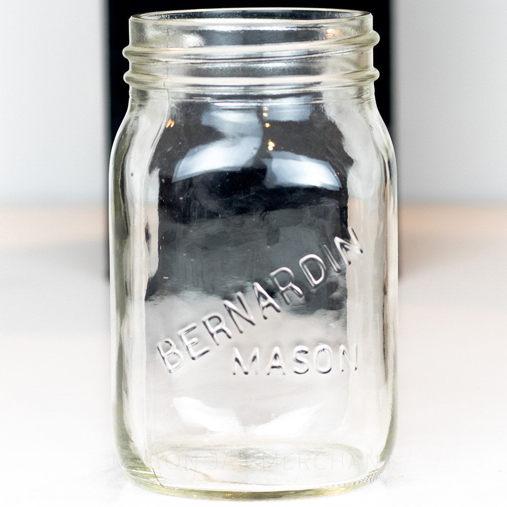 Regular mouth pint mason jar with Berndardin Mason logo, on a white background