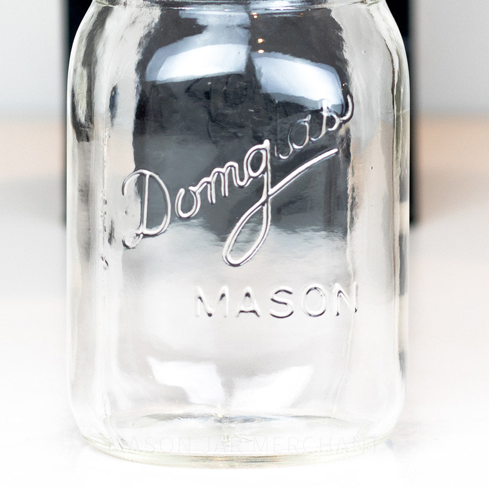Regular mouth pint mason jar with Domglas logo on a white background