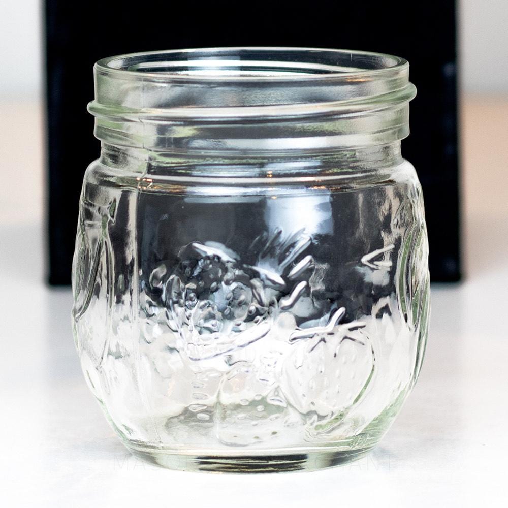 6.5 oz regular mouth mason jar with a unique bulb shape and a fruit pattern on a white background
