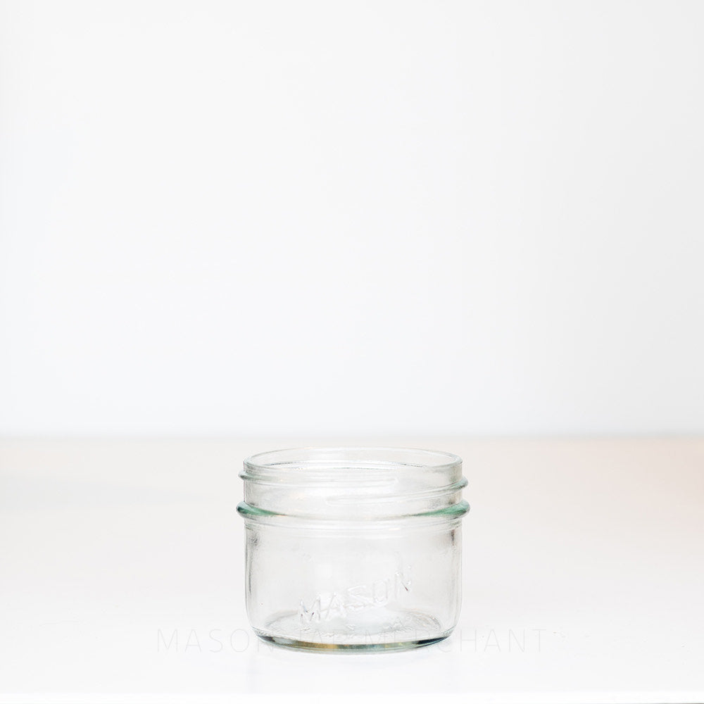 Wide Mouth Half Pint Mason Jar with Salmon on the side of the jar, shot on a white background.