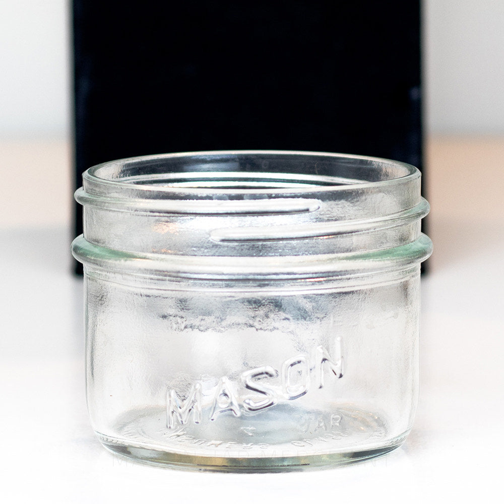 Wide Mouth Half Pint Mason Jar with Salmon on the side of the jar, shot on a white background.