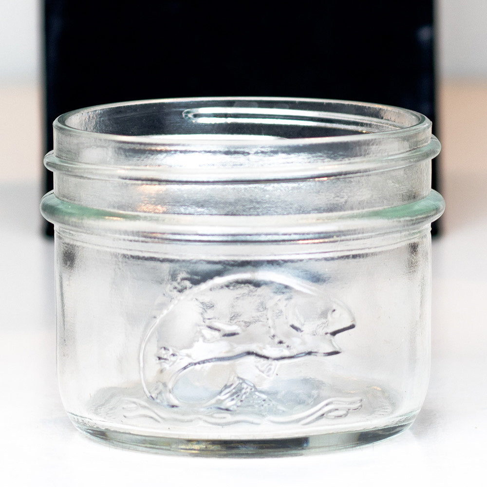 close up of a Wide Mouth Half Pint Mason Jar with Salmon on the side of the jar, shot on a white background.