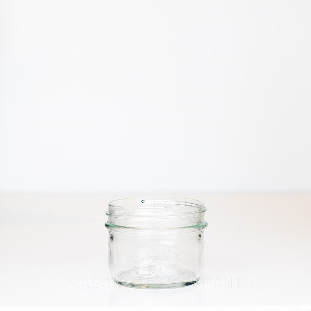 Wide Mouth Half Pint Mason Jar with Salmon on the side of the jar, shot on a white background.