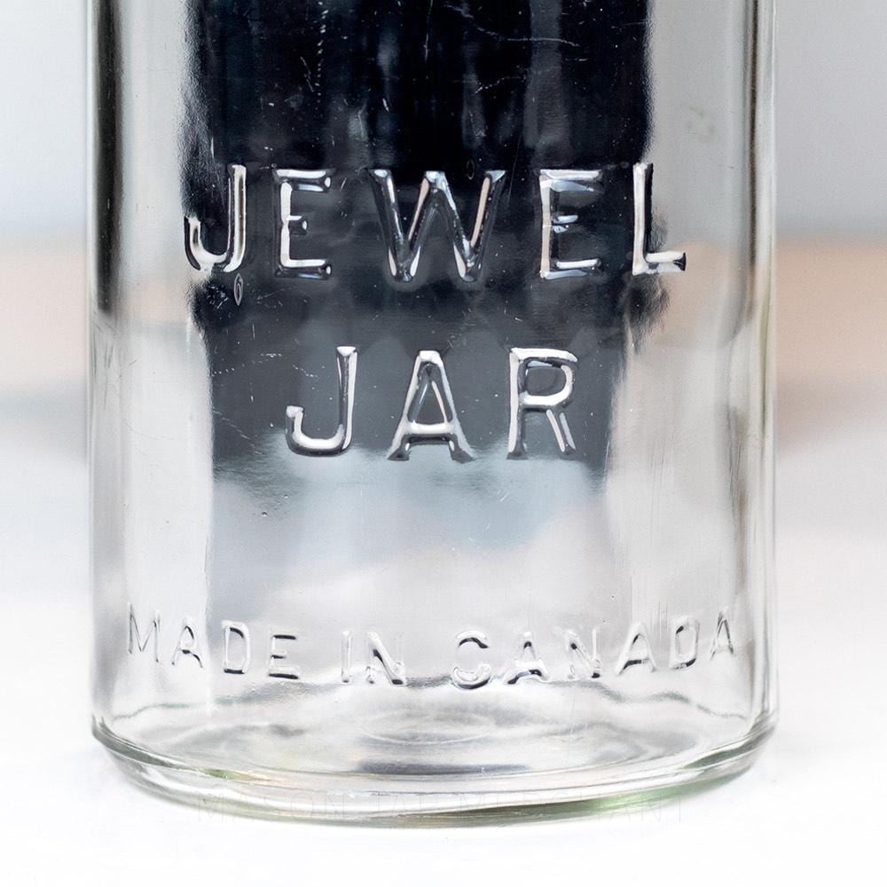 Vintage gem mouth quart mason jar with Jewel Jar logo, on a white background